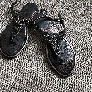 T strap black flat leather sandal with jewel detail